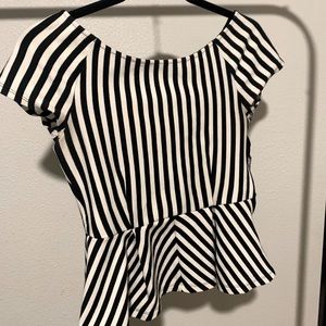Black and White top with pelleted at the bottom